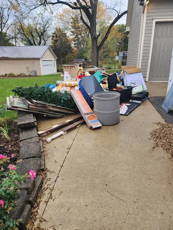 Dumpster being loaded with debris for Commercial Dumpster Rental in Cleveland Heights